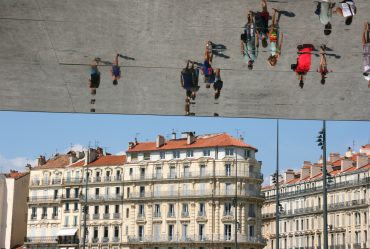Tourists reflecting in a mirror the vieux port Marseille